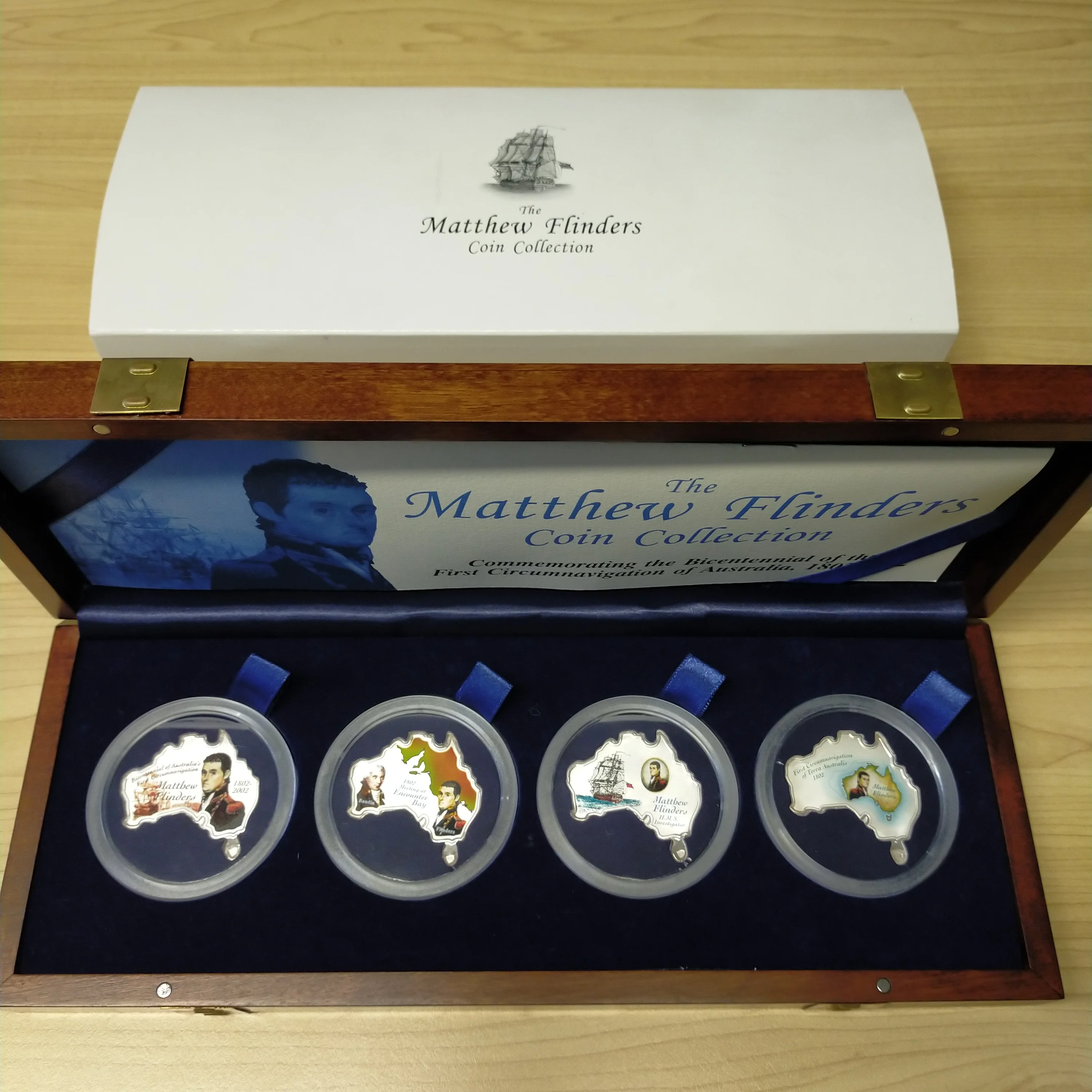 Uganda  Australia 2002 Perth Mint The Matthew Flinders  Map of Australia Coin Collection of 4 x 1oz Coloured Silver Coins